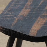 Close-up of a wooden table with a textured surface