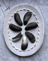 Porcelain Smoke Fired Shells with Copper Guilding