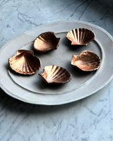 Porcelain Smoke Fired Shells with Copper Guilding