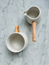 Twig Handled Porcelain Mugs and Jugs with Lichen Orange Glaze