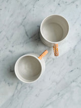 Twig Handled Porcelain Mugs and Jugs with Lichen Orange Glaze