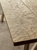 Close-up of a wooden table with a textured surface