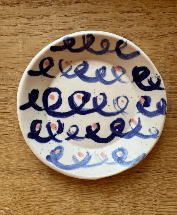 The Merchants Table illustrated small plate by Celia Wood loop de loop 