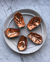Porcelain Smoke Fired Shells with Copper Guilding