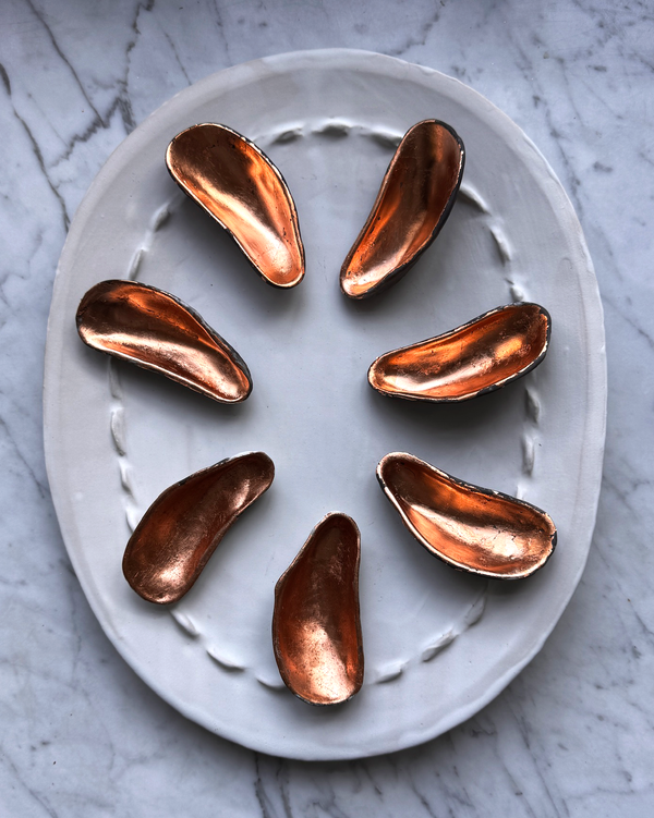 Porcelain Smoke Fired Shells with Copper Guilding