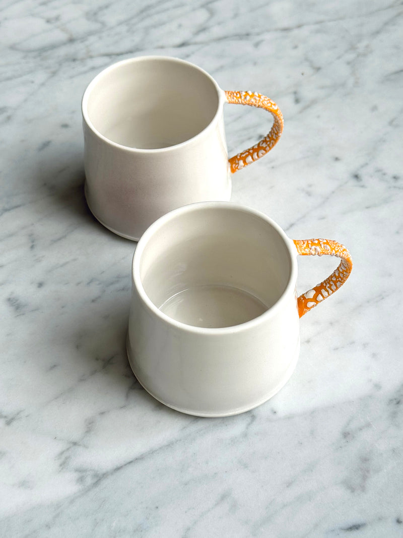Twig Handled Porcelain Mugs and Jugs with Lichen Orange Glaze