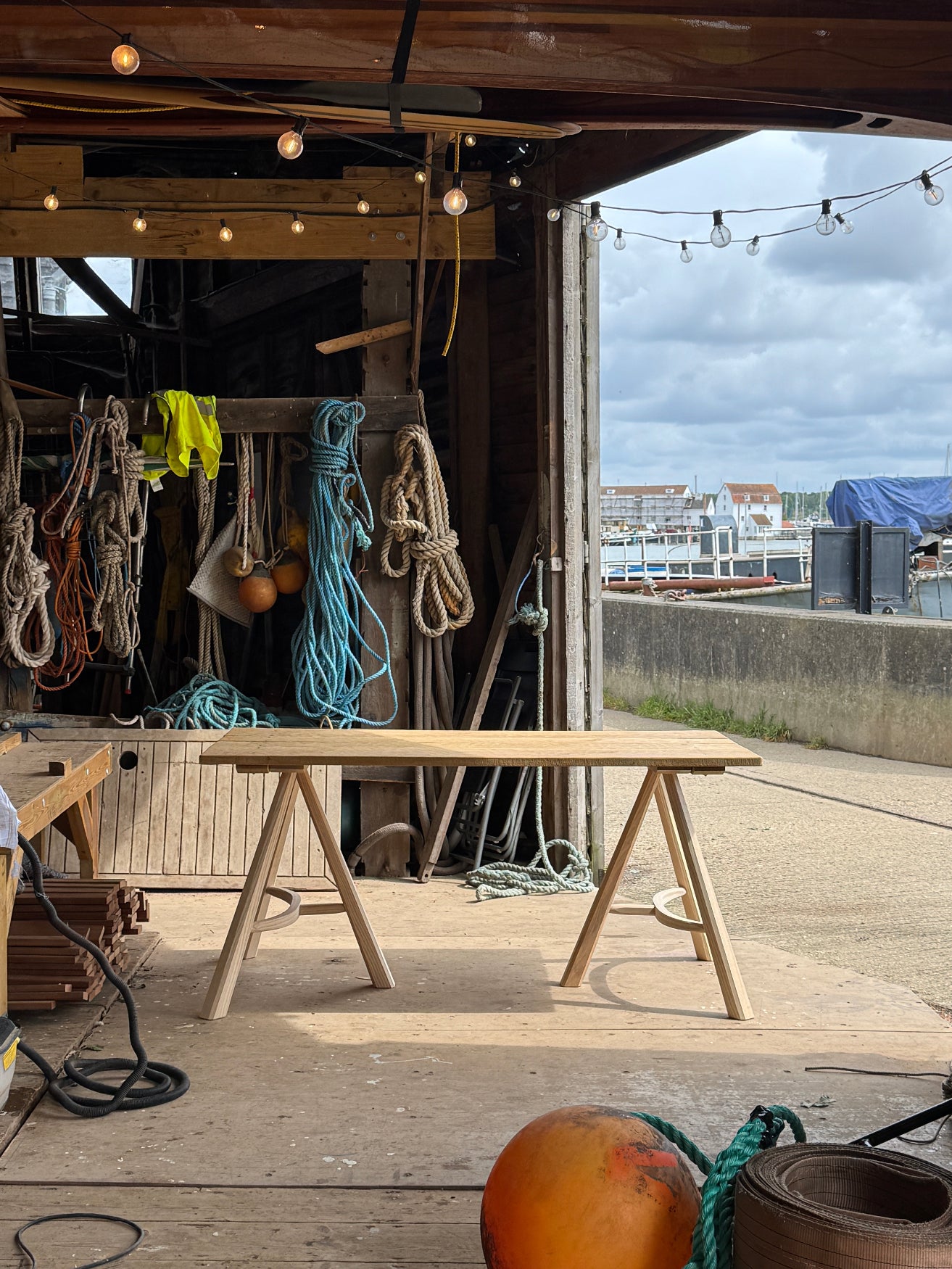 Woodbridge wooden Victorian  Boatshed with boat ropes and The Merchant’s Table Suffolk Trestle Tablle